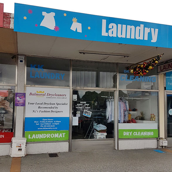 Gray Car in front of the Balmoral Drycleaners Store